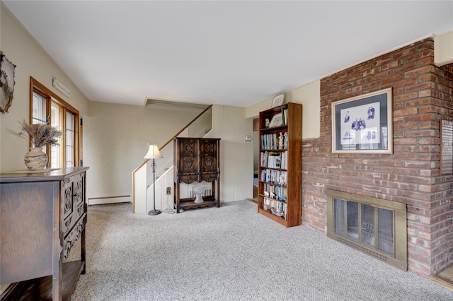 living room featuring a baseboard heating unit, a fireplace, carpet, and stairway