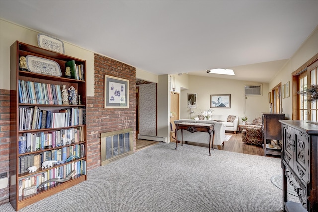 living area with an AC wall unit, lofted ceiling with skylight, carpet flooring, baseboard heating, and a fireplace