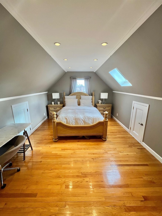 1258 Mace Ave, Bronx, NY 10469 - bedroom with light wood-style floors, vaulted ceiling with skylight, and baseboards