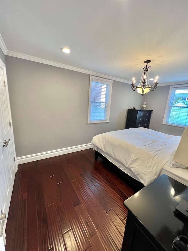 1258 Mace Ave, Bronx, NY 10469 - bedroom with an inviting chandelier, crown molding, wood finished floors, and baseboards