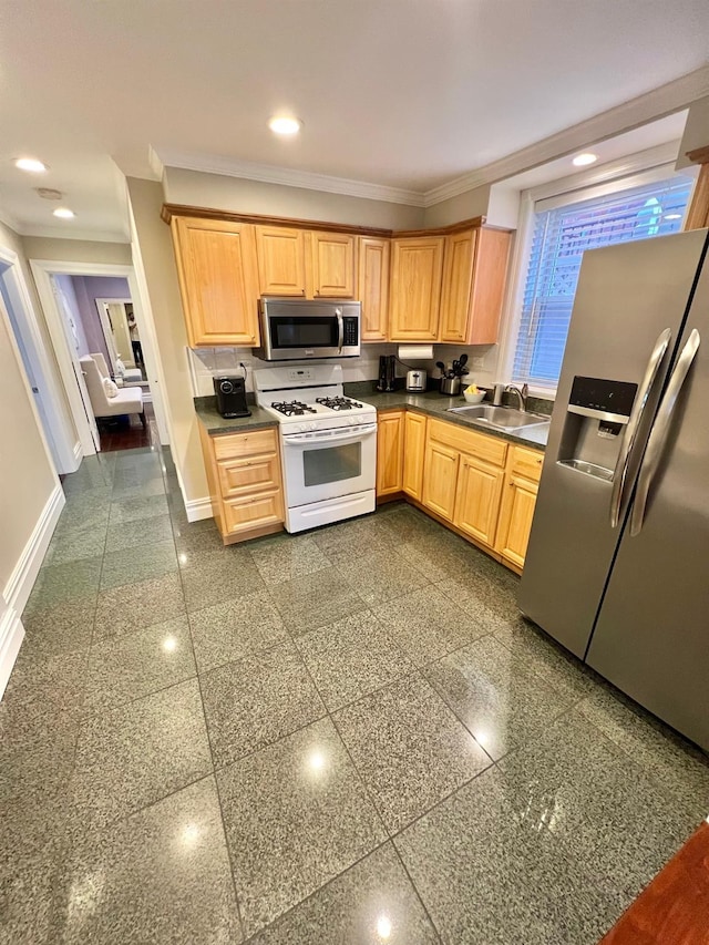 1258 Mace Ave, Bronx, NY 10469 - kitchen featuring dark countertops, a sink, appliances with stainless steel finishes, baseboards, and ornamental molding