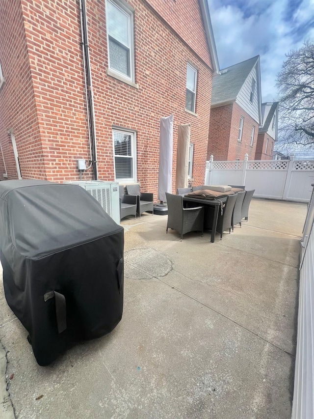 1258 Mace Ave, Bronx, NY 10469 - view of patio featuring fence, an outdoor hangout area, central air condition unit, outdoor dining space, and grilling area