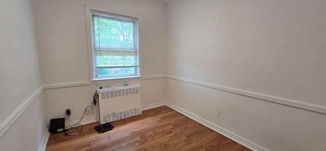 47-65 196th St, Flushing, NY 11358 - unfurnished room with radiator and dark wood finished floors