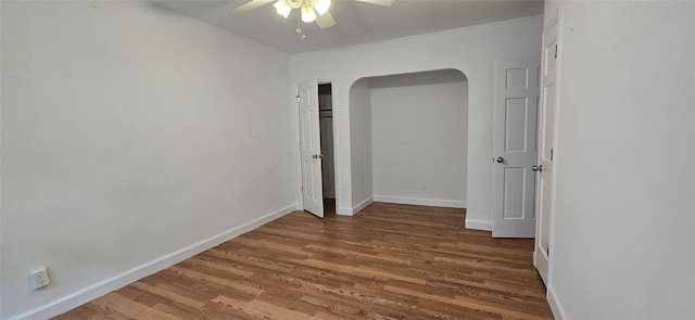 47-65 196th St, Flushing, NY 11358 - unfurnished room with ceiling fan, wood finished floors, and arched walkways
