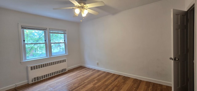 47-65 196th St, Flushing, NY 11358 - empty room featuring radiator heating unit, wood finished floors, and ceiling fan