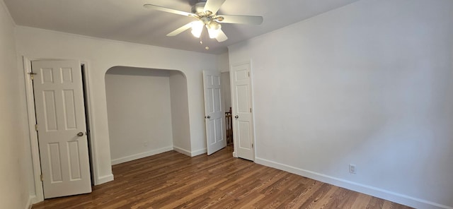 47-65 196th St, Flushing, NY 11358 - unfurnished room featuring wood finished floors, arched walkways, and ceiling fan
