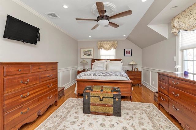80 Park Ave, New Hyde Park, NY 11040 - bedroom with wainscoting, wood finished floors, visible vents, and ornamental molding