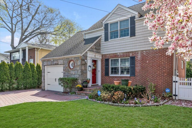 80 Park Ave, New Hyde Park, NY 11040 - view of front of house with roof with shingles, fence, a garage, a front yard, and decorative driveway