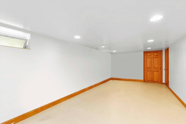below grade area featuring recessed lighting and baseboards