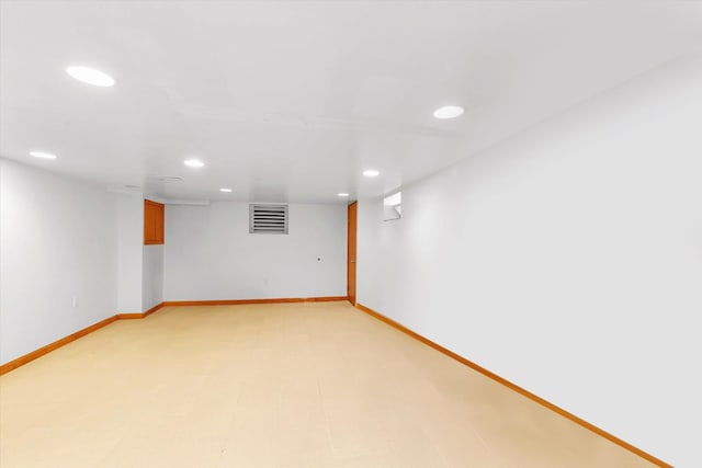 finished below grade area with recessed lighting, baseboards, and visible vents