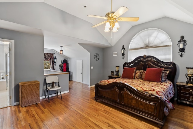 bedroom with wood finished floors, ceiling fan, and lofted ceiling