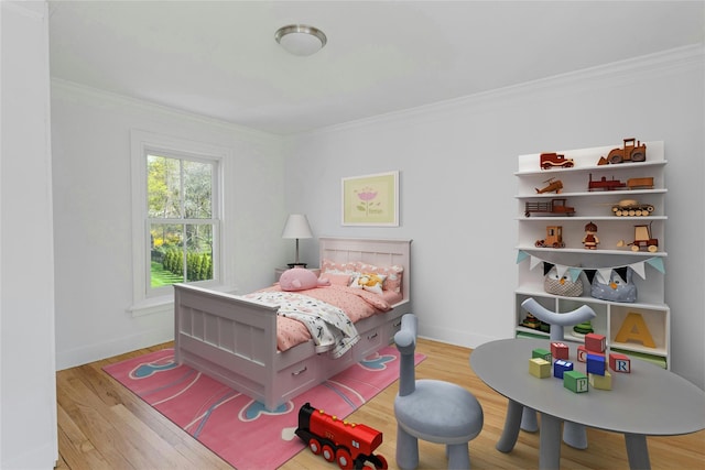 bedroom featuring crown molding, baseboards, and light wood-type flooring