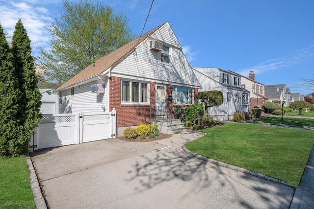 1041 N 6th St, New Hyde Park, NY 11040 - view of front facade featuring a gate and brick siding