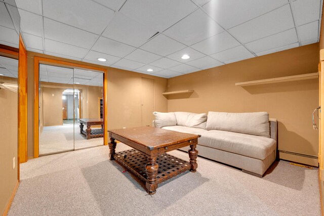 1041 N 6th St, New Hyde Park, NY 11040 - carpeted living room featuring a baseboard radiator, recessed lighting, a paneled ceiling, and baseboards