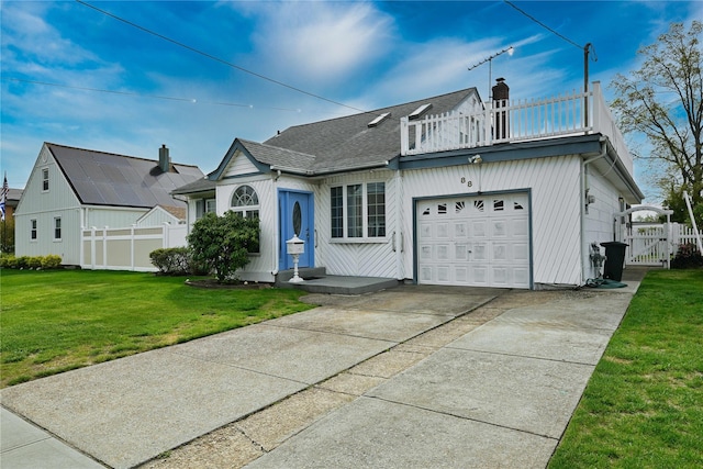 view of front facade with a gate, fence, a chimney, and a garage