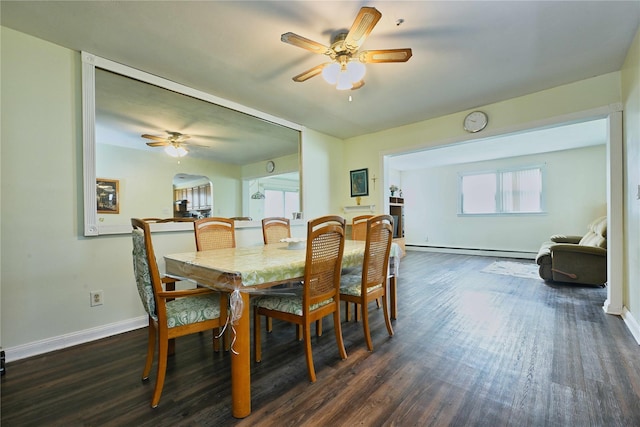 dining area featuring ceiling fan, baseboards, dark wood-style flooring, and a baseboard radiator