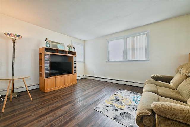living area with dark wood-style floors, baseboard heating, and baseboards