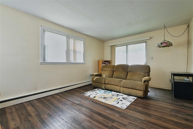 living room with dark wood-style floors, baseboard heating, and baseboards