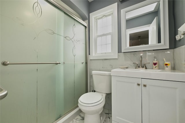 full bath with vanity, tasteful backsplash, toilet, a stall shower, and marble finish floor