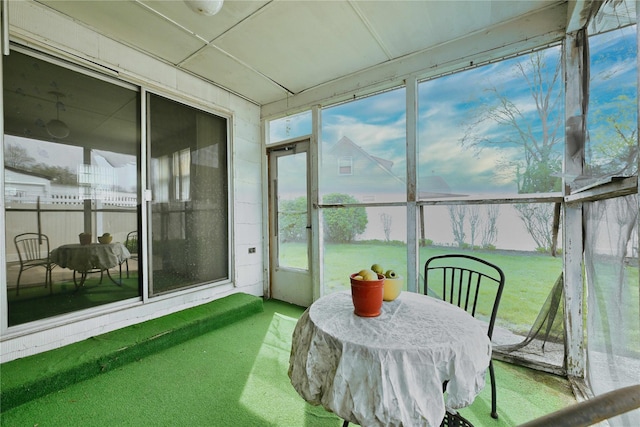 sunroom / solarium featuring carpet flooring