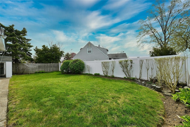view of yard with a fenced backyard