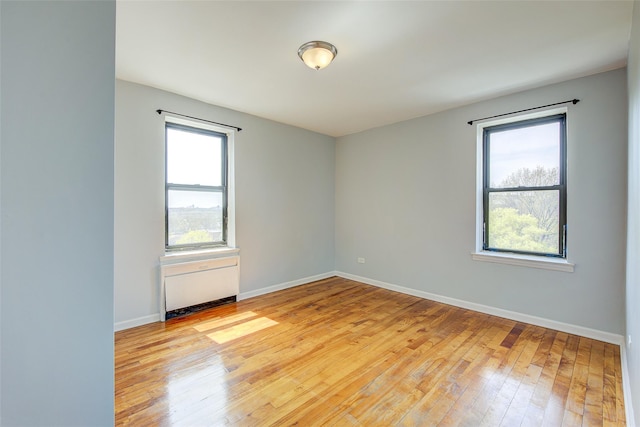 170-06 Crocheron Ave Unit 5D, Flushing, NY 11358 - unfurnished room featuring baseboards and light wood finished floors