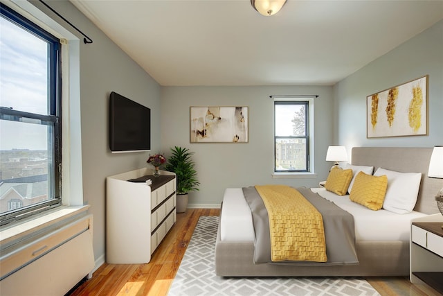 170-06 Crocheron Ave Unit 5D, Flushing, NY 11358 - bedroom with baseboards and light wood finished floors