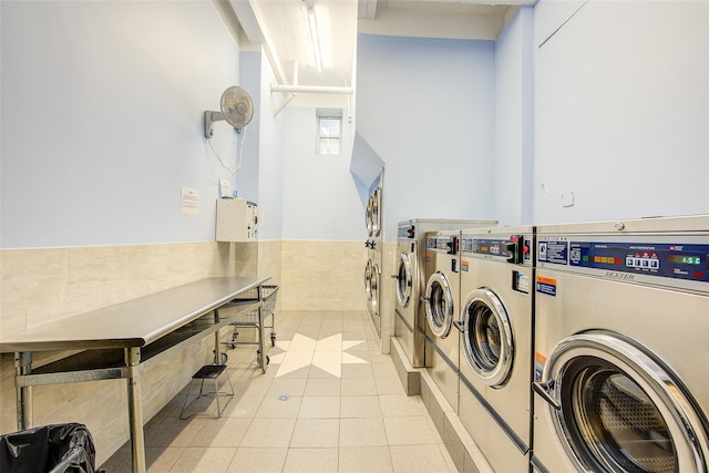 170-06 Crocheron Ave Unit 5D, Flushing, NY 11358 - shared laundry area featuring independent washer and dryer, tile walls, light tile patterned floors, and a wainscoted wall