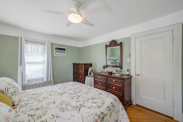 bedroom featuring radiator and ceiling fan