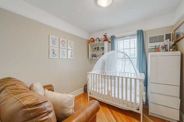 bedroom with wood finished floors