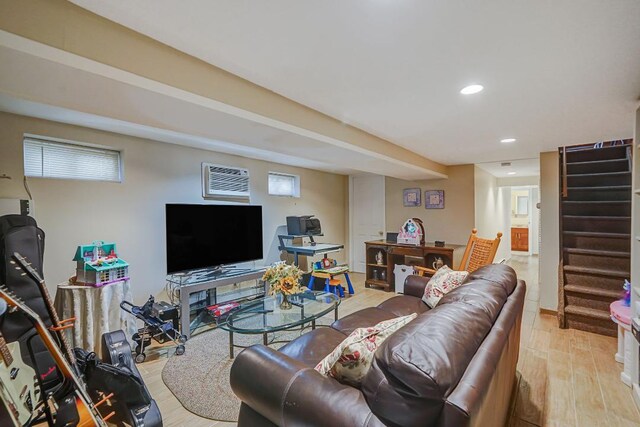 living area featuring light wood finished floors, recessed lighting, and stairway
