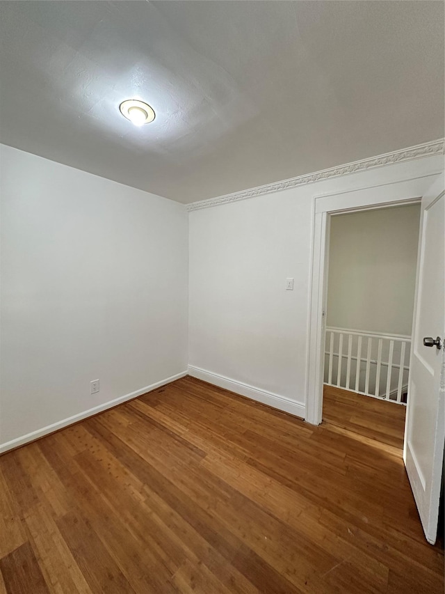 88-39 186th St, Hollis, NY 11423 - empty room featuring wood finished floors and baseboards