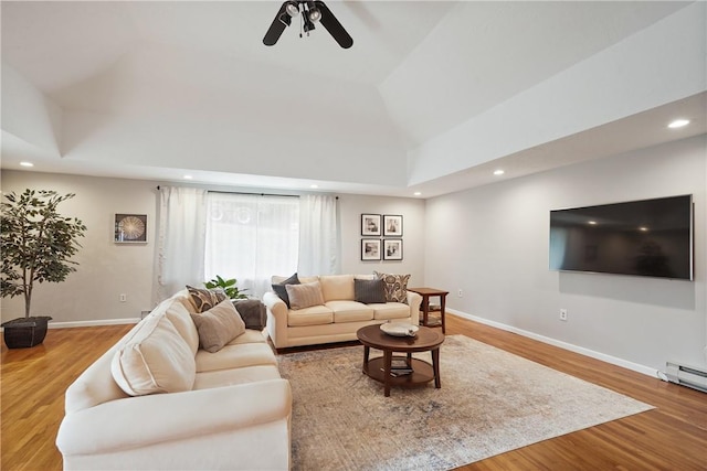 living room with recessed lighting, wood finished floors, a ceiling fan, and baseboards