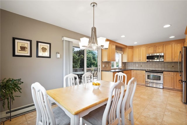 dining room with a baseboard radiator, light tile patterned floors, a chandelier, and recessed lighting