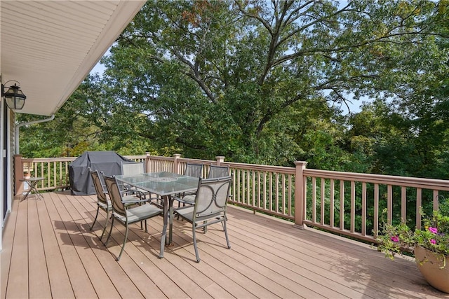 wooden deck with outdoor dining space