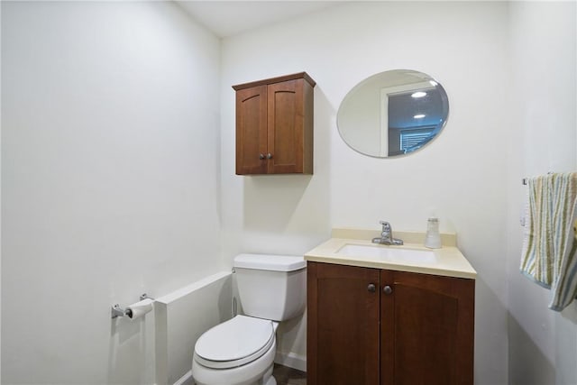 bathroom with toilet and vanity