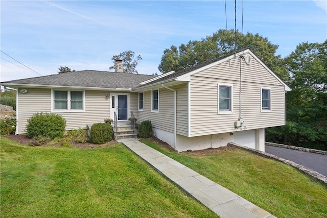 single story home featuring a chimney, a front lawn, an attached garage, driveway, and roof with shingles