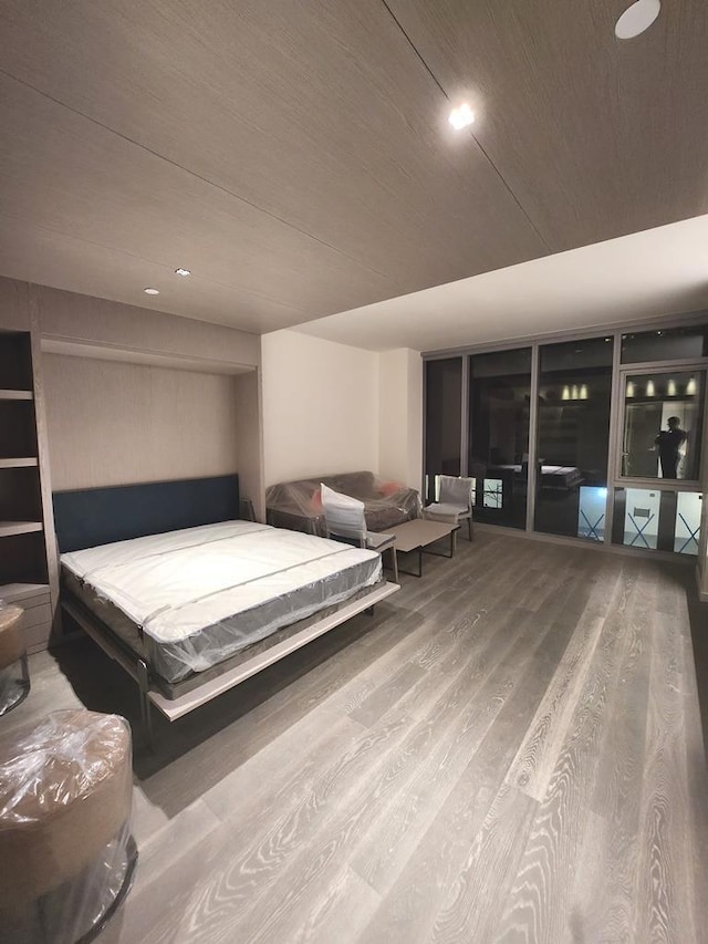 bedroom featuring wood ceiling, wood finished floors, and recessed lighting