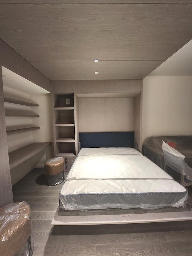 bedroom with wood finished floors