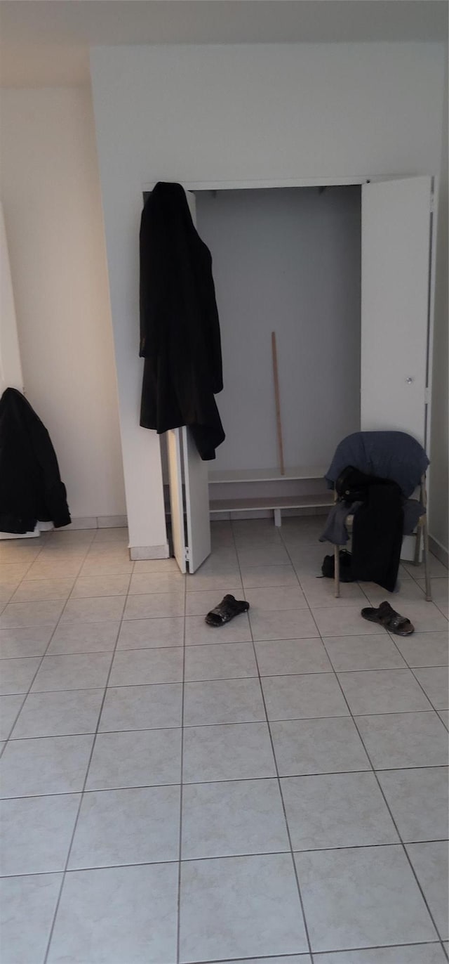 interior space with light tile patterned floors