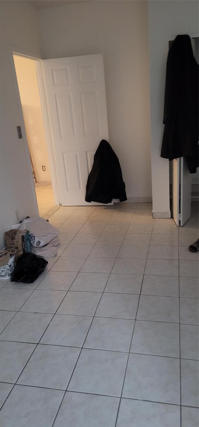 unfurnished bedroom featuring light tile patterned floors