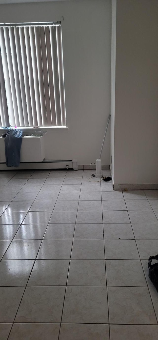 spare room featuring light tile patterned floors