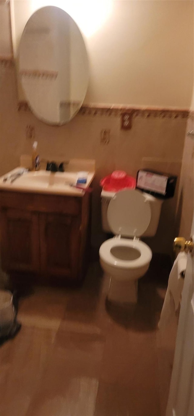 bathroom featuring toilet and vanity