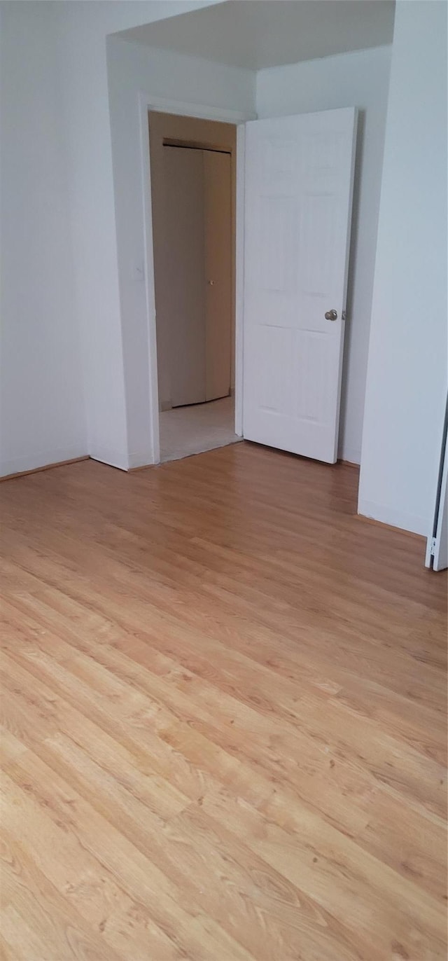 spare room with light wood-style floors