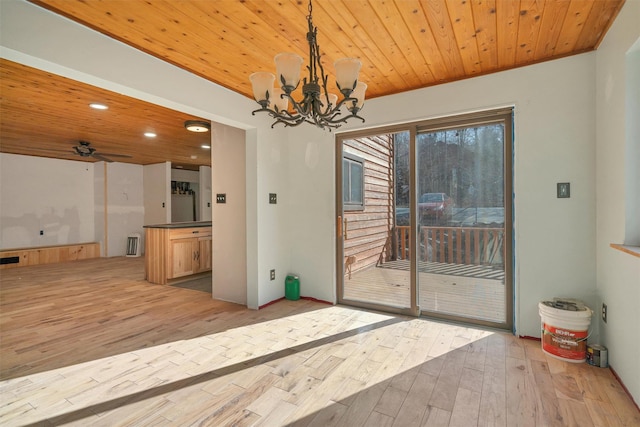 unfurnished dining area with hardwood / wood-style flooring, wood ceiling, a notable chandelier, and recessed lighting