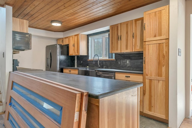 kitchen with dark countertops, wooden ceiling, freestanding refrigerator, and stove