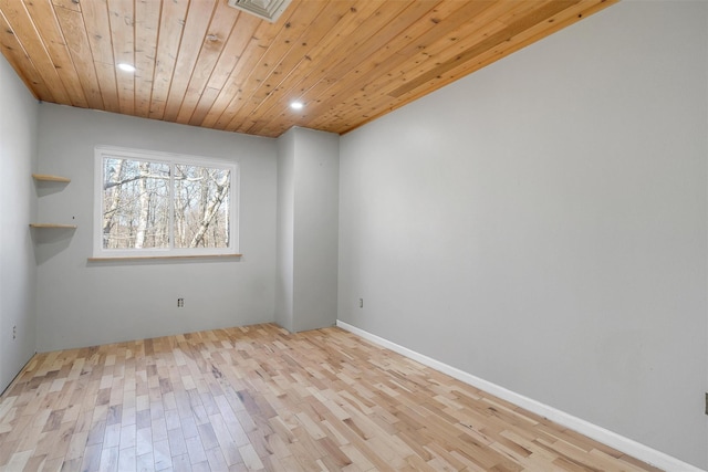 unfurnished room with recessed lighting, light wood-style flooring, visible vents, and wooden ceiling