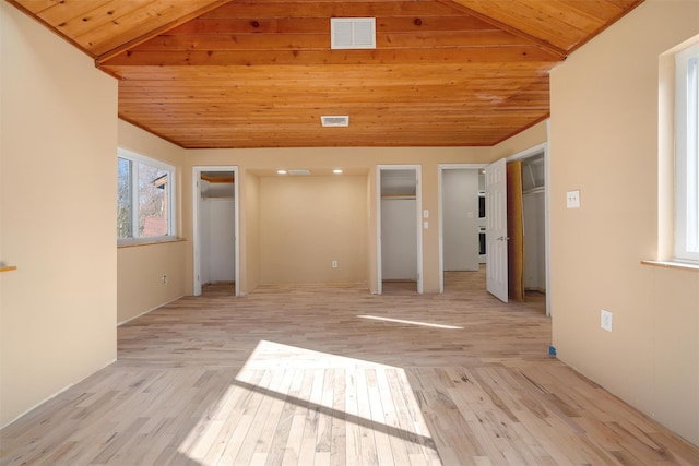 unfurnished bedroom with wood ceiling, vaulted ceiling, visible vents, and light wood-style flooring