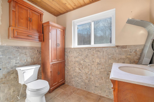 bathroom featuring tile walls, tile patterned floors, and wooden ceiling