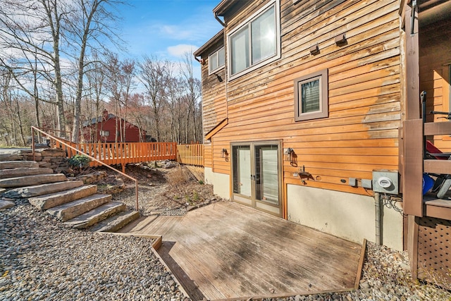 exterior space featuring a deck, stairs, and french doors